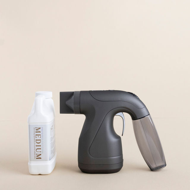 JMT Sunless ProMist Mini spray tan machine with solution bottle