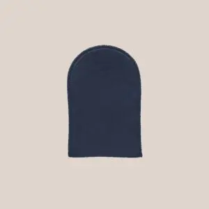Navy tanning application mitt on a neutral background.