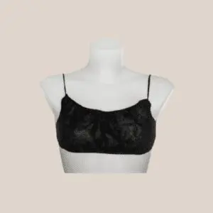 Black cropped top displayed on a mannequin.
