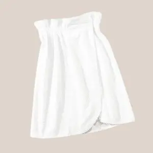 White wrap skirt on a neutral background.