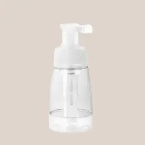 Clear pump bottle for skincare or tanning products.